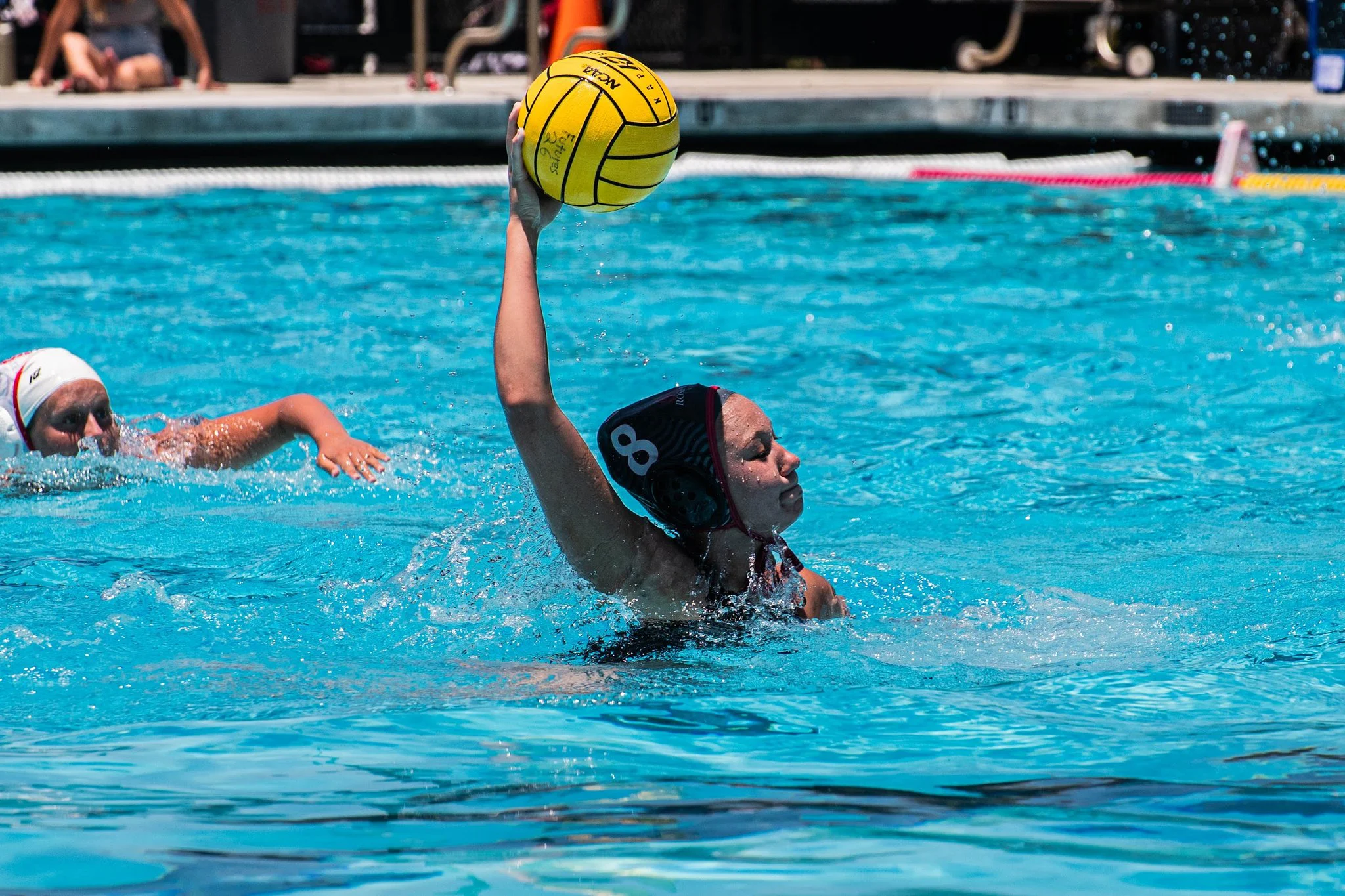 Girls water polo player takes an outside shot